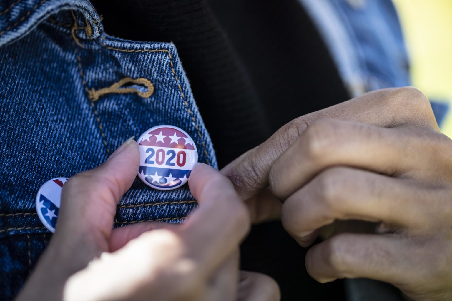 2020 written on a button pinned on a jacket