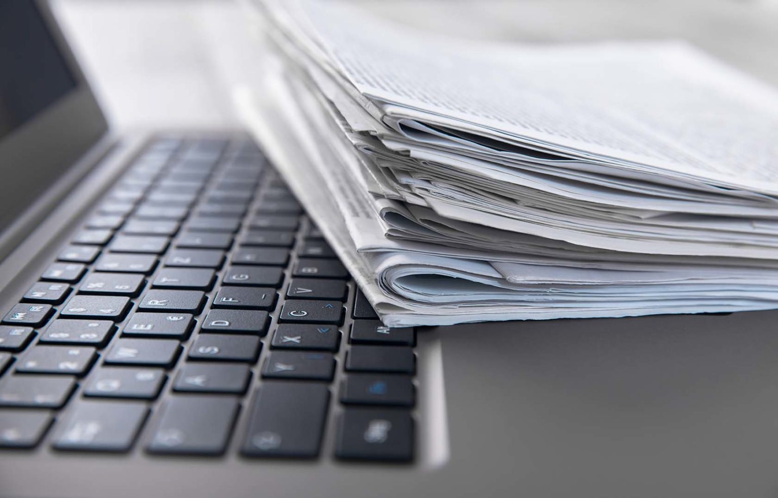 Newspaper and computer keyboard