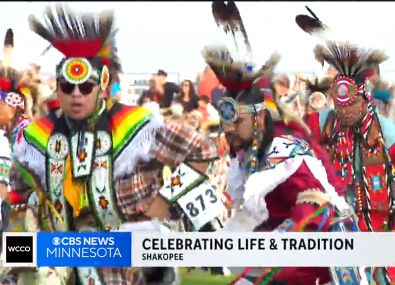 Dakota dancers dance in colorful clothing at Wacipi