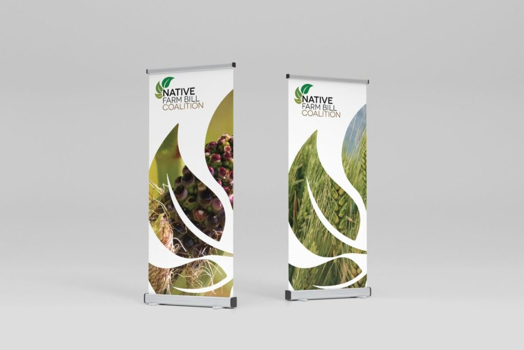 Two standing posters for the Native Farm Bill Coalition showing leaf shapes with food and plants inside them.