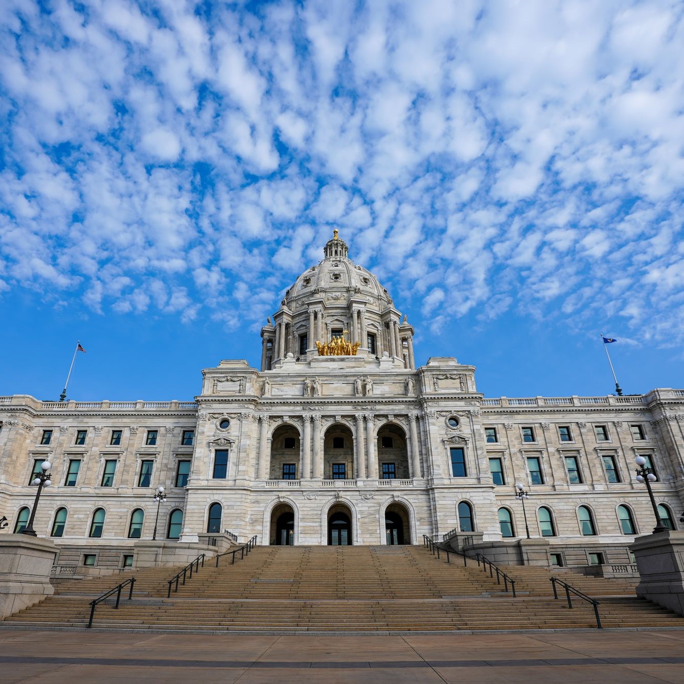 Minnesota state Capitol building from the outside on a sunny day with blue skies