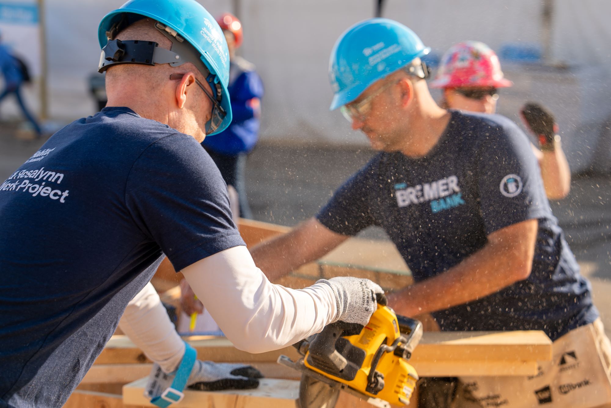 Two Bremer Bank employees work on a construction project