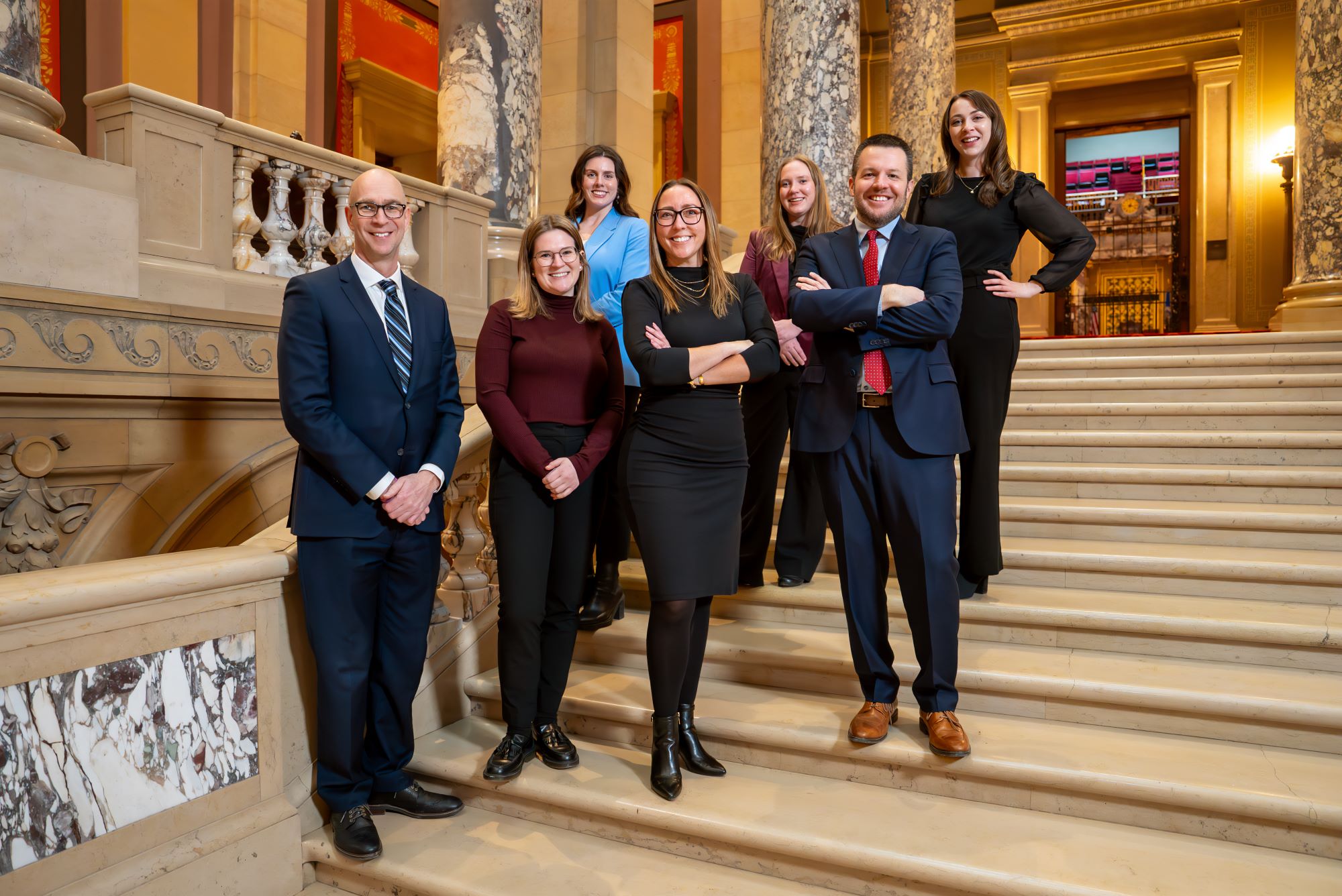 Goff Public's public affairs team poses on steps inside the Capitol