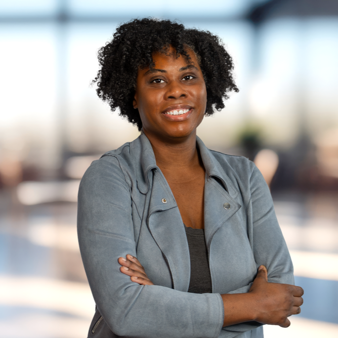 Headshot of a Black woman wearing a gray blazer