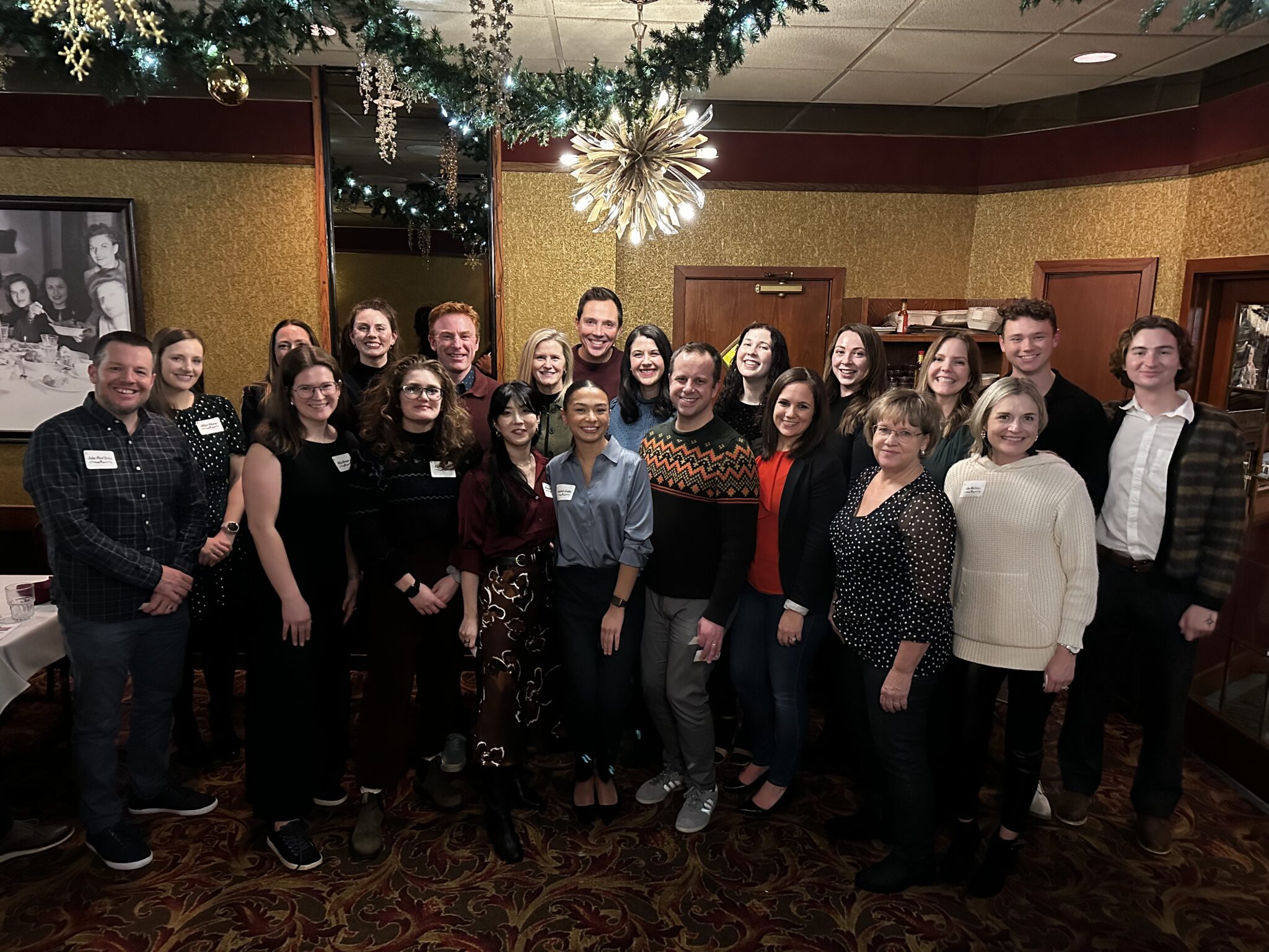 The Goff Public team poses for a group photo at a restaurant